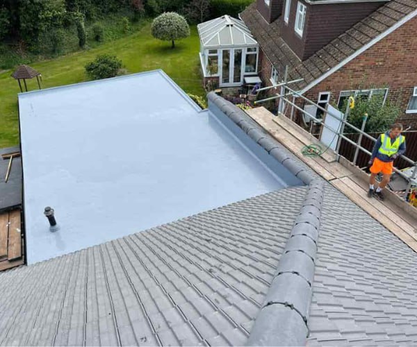 This is a photo of a newly installed hip roof, with a combined liquid covered flat roof. Work carried out by KAD Roofing Bircotes.