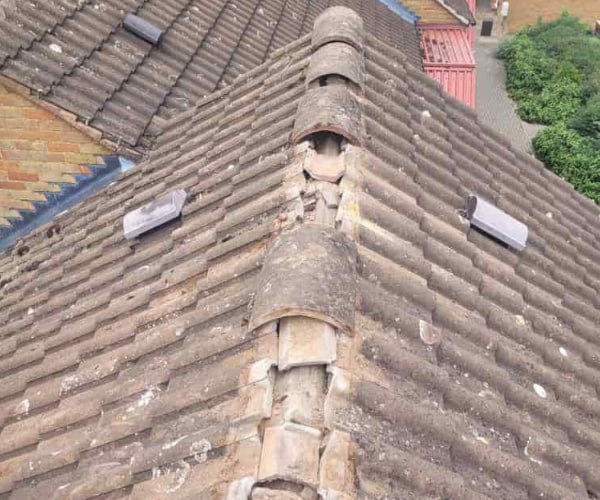 This is a photo if a roof ridge which has missing tiles. The ridge tiles are being replaced by KAD Roofing Bircotes